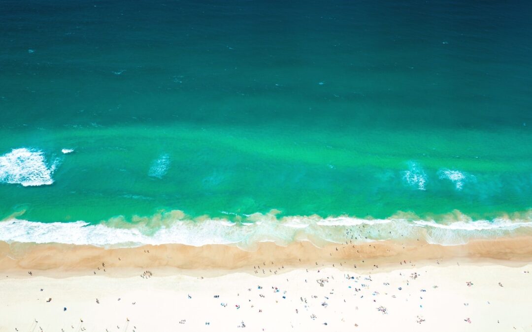 Aerial of Kurrawa Beach Broadbeach with clear turquoise water and golden sand near Boulevard Towers